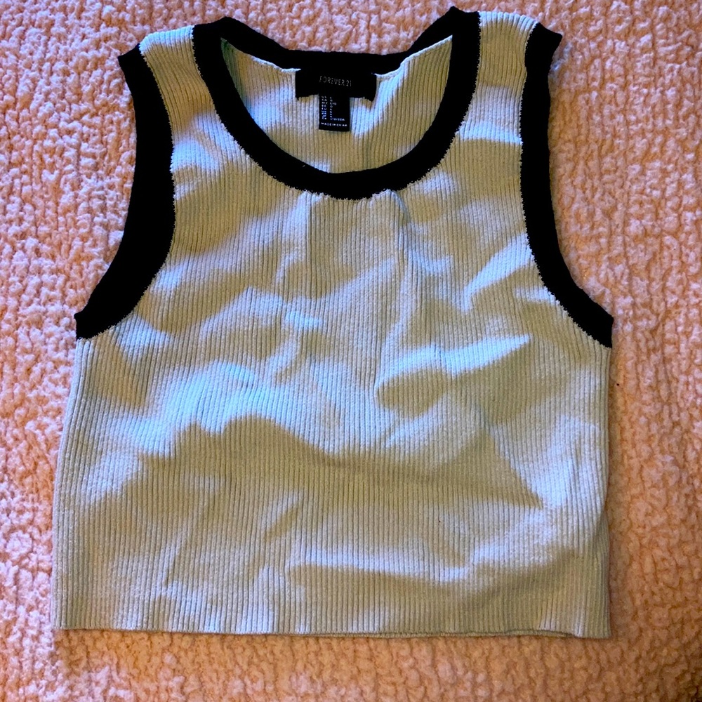 Sleeve less black and cream crop top